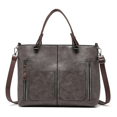 Vintage skuldertaske til kvinder i læderlook med justerbar rem og rummeligt design