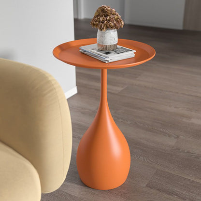 Rundt sidebord i metal med søjlefod, moderne minimalistisk design og robust jern