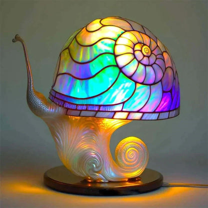 Bordlampe i farvet glas med dekorativ LED-belysning