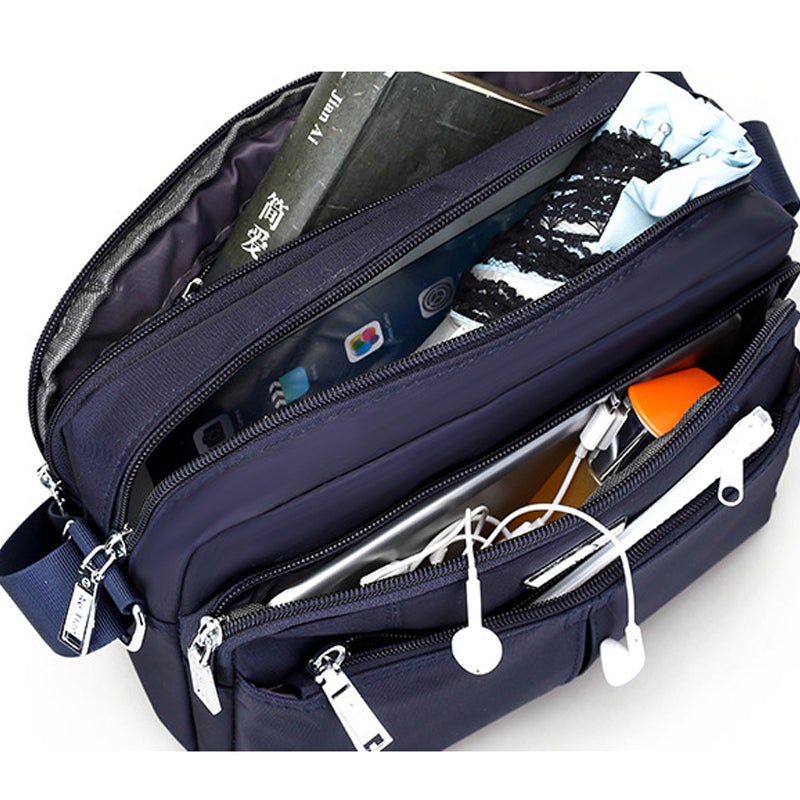 Vandafvisende messenger skuldertaske med flere lommer og justerbar skulderrem